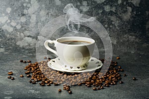 Coffee background. Coffee beans and cup on dark backgrpund. Coffee banner for menu, design and decoration