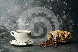 Coffee background. Coffee beans and cup on dark backgrpund. Coffee banner for menu, design and decoration