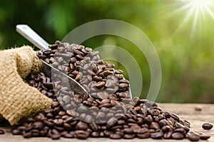 Coffee bean bag and coffee roasted over nature green background