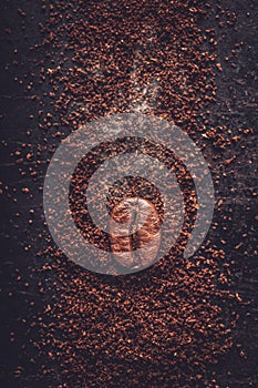 Coffee bean in a closeup macro on a dark background