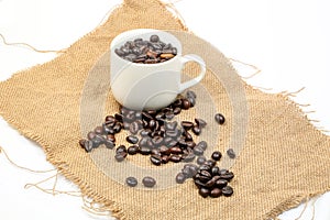 Coffee bean cup on jute fabric