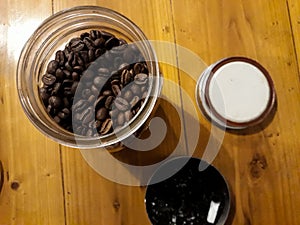 Coffee bean in a jar on wooden table background