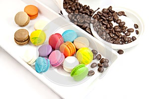 Coffee bean and mini macaroon colorful in white caramic plate