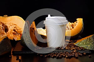 Coffee bean pumpkin spice latte nutrition recipie mock up. cut pumpkin coffee beans and white paper cup for coffee break