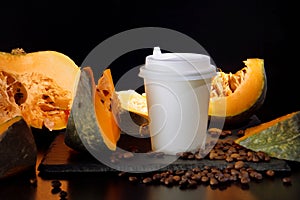 Coffee bean pumpkin spice latte nutrition recipie mock up. cut pumpkin coffee beans and white paper cup for coffee break