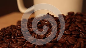 Coffee Bean Tracking Shot - Left to Right - Falling Coffee Beans - Freshly brewed coffee with whole coffee beans.