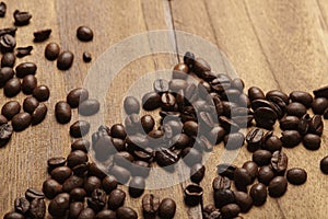 Coffee Beans on Zebrano wood table photo