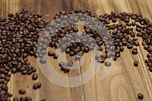 Coffee Beans on Zebrano wood table top photo