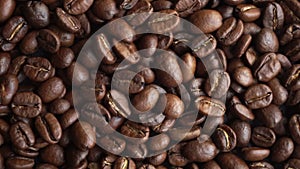 Coffee beans background. Making and roasting coffee beans for a drink.  Food and drinks video, top view