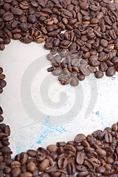 Coffee beans background. Roasted aromatic brown coffee beans close up