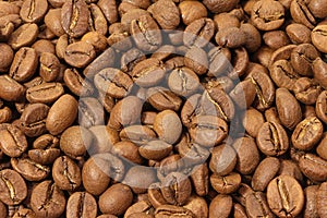 Coffee beans background, texture, pattern. Pile of coffee