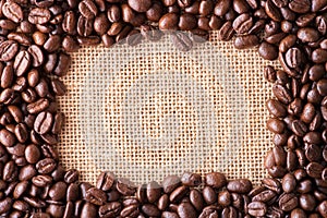 Coffee beans on bag background with copy space