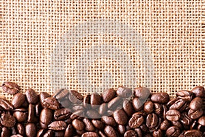 Coffee beans on bag background with copy space