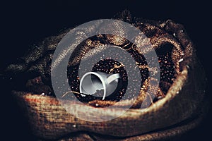 Coffee beans in a bag. one bag lies.