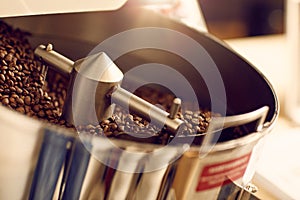 Coffee beans being roasted in a modern roastery