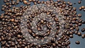 Coffee Beans on black background. Close-up dolly shot.