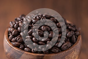 Coffee beans. Black fresh roasted coffee beans.Peaberry coffee beans are a unique coffee bean that have a much richer flavor.