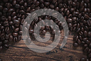 Coffee beans. Black fresh roasted coffee beans.Peaberry coffee beans are a unique coffee bean that have a much richer flavor.