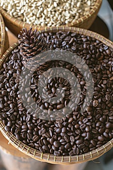 Coffee beans and black pine cone