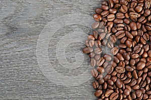 Coffee beans border on old oak table