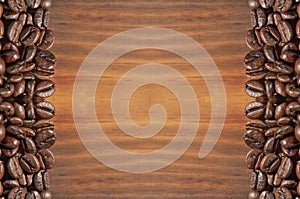 Coffee beans on a bright brown wooden background