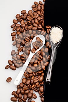 Coffee beans, brown sugar and small teaspoons