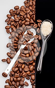 Coffee beans, brown sugar and teaspoons