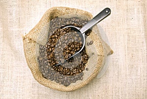 Coffee Beans In Burlap Bag With Scoop