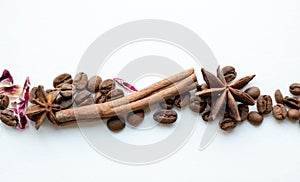 Coffee beans cinnamon sticks and star anise. Whole grains with aromatic spices, roasted coffee, blur
