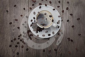 coffee beans circling over coffee cup