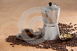 Coffee beans, coffee, coffeemaker and scoop photo