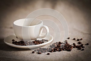 COFFEE BEANS AND COFFEE CUP