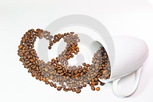 Coffee beans in coffee cup on white background with hearth shape