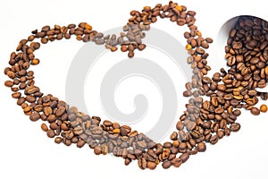 Coffee beans in coffee cup on white background with hearth shape