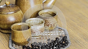 Coffee beans and coffee cups set on wooden background.Vintage style.(soft focus)