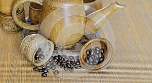 Coffee beans and coffee cups set on wooden background.Vintage style.(soft focus)