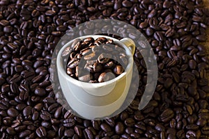 Coffee beans in coffee white cup