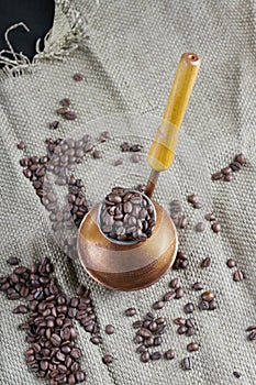 Coffee beans and copper coffee maker