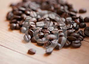 Coffee beans, counter and espresso drink or caffeine preparation for beverage, cafe or cappuccino. Roasted, blend and