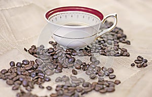 coffee beans and cup with hot espresso