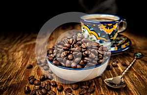 Coffee beans with cup and saucer