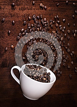 Coffee beans with cup on a table