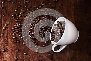 Coffee beans with cup on a table