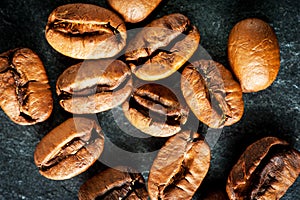 Coffee beans on dark background, macro shot