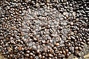 Coffee beans dark roat on hand at home for background