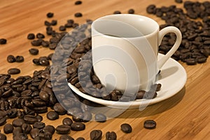 Coffee Beans with Demitasse Espresso Cup photo