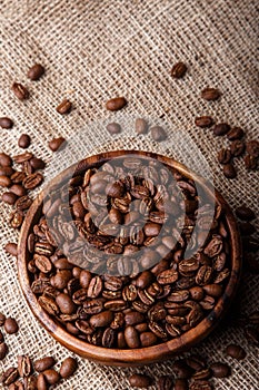 Coffee beans in dish on bag