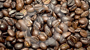 Coffee beans falling down close up view