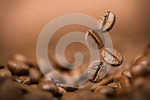 Coffee beans falling on pile