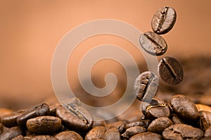 Coffee beans falling on pile